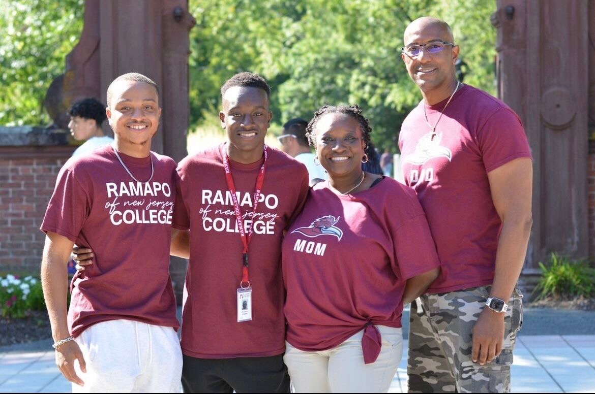 Family of four, including Ramapo students standing in front of the Arch with their parents