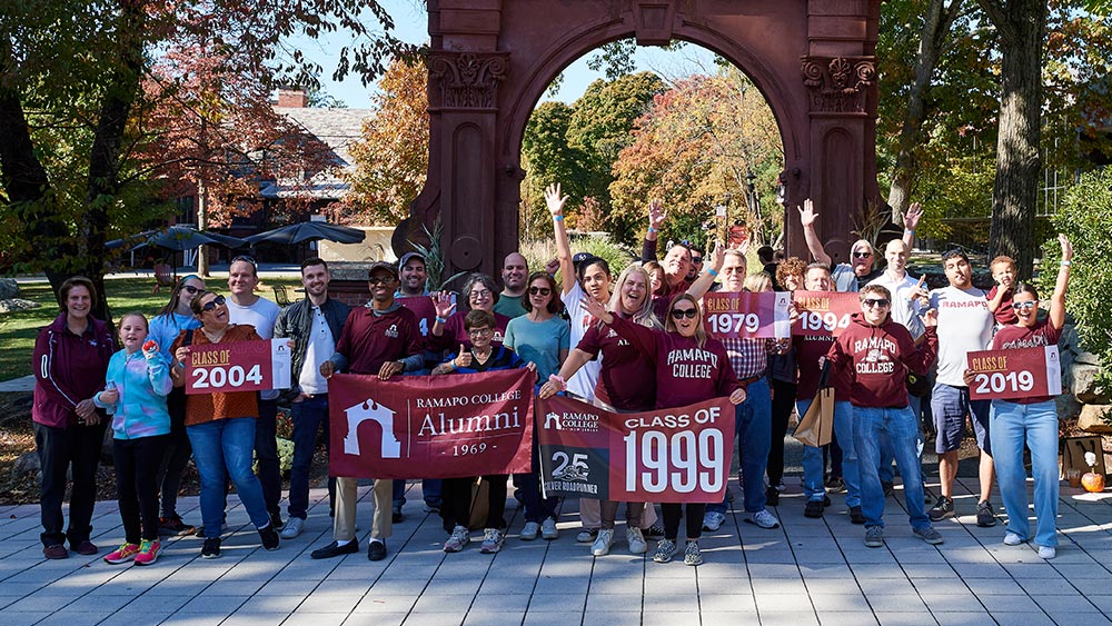 Ramapo Alumni by the arch
